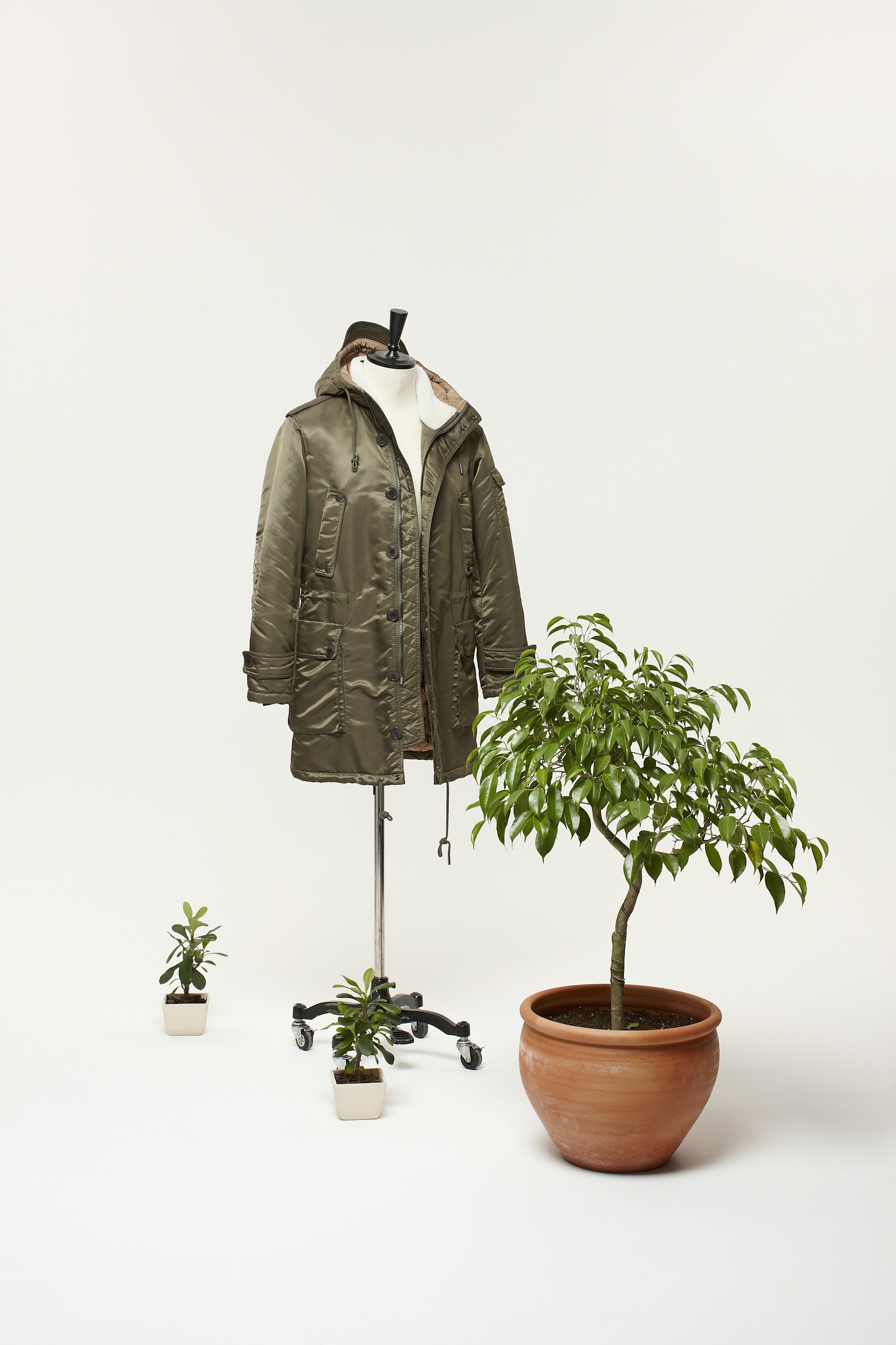 Apparel displayed alongside living plants